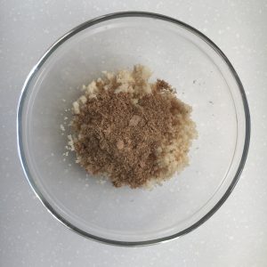 Riced cauliflower with ground flax in a glass bowl