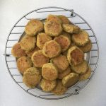 Round metal rack holding finished Lebanese falafels