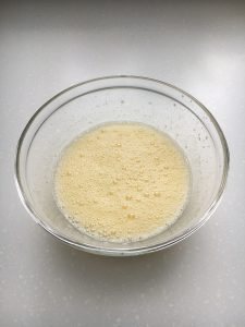 Eggs and sugar beaten together in a bowl