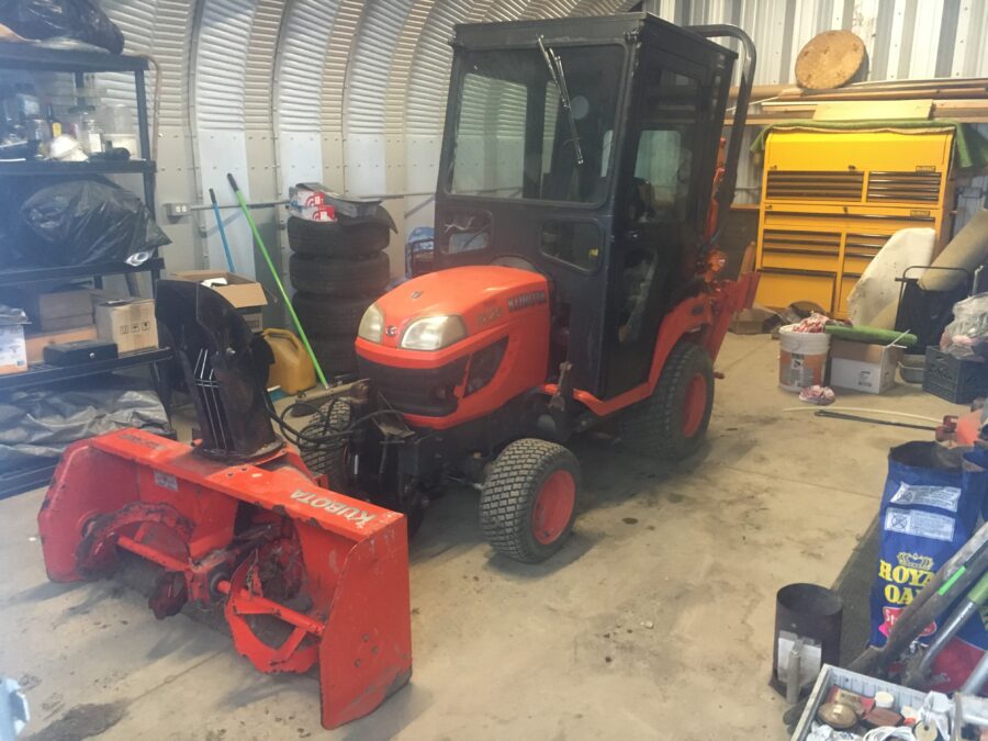 Front view of BX25 with cab and snowblower